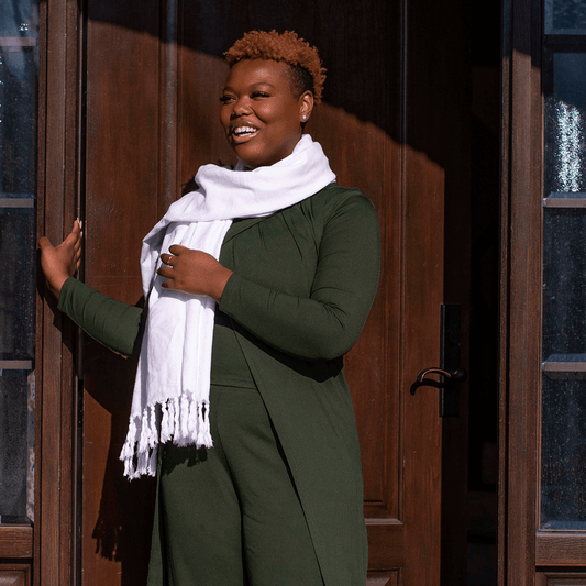 Smiling woman wears a Turkish towel as a scarf outside in Canada