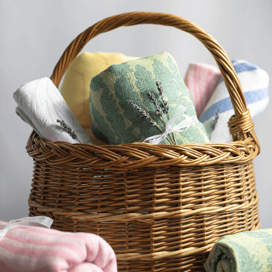 Wicker basked full of Turkish towels to gift