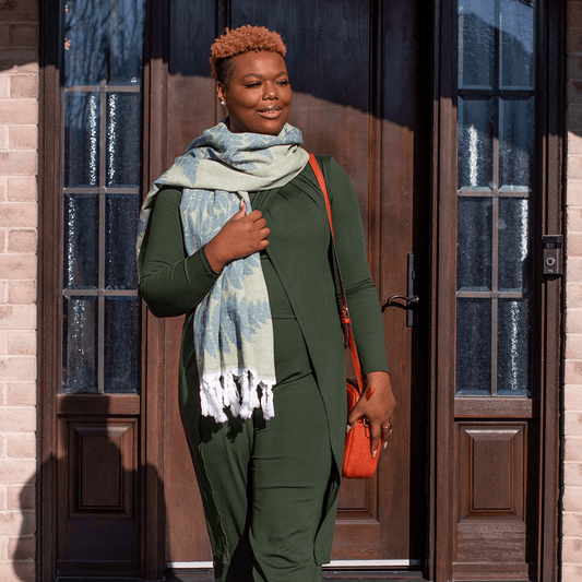 Smiling woman wears a Turkish towel as a scarf outside in Canada