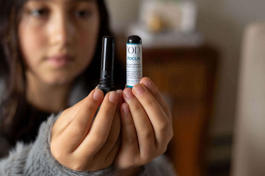 Woman holding aromatherapy wand