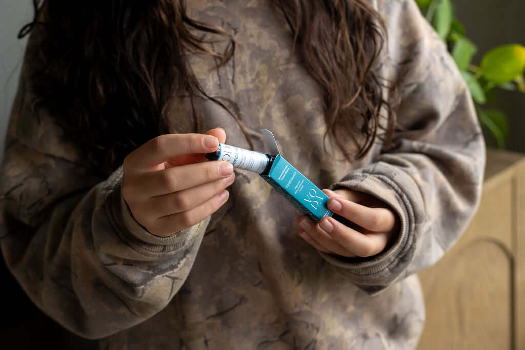 Hands holding aromatherapy wand