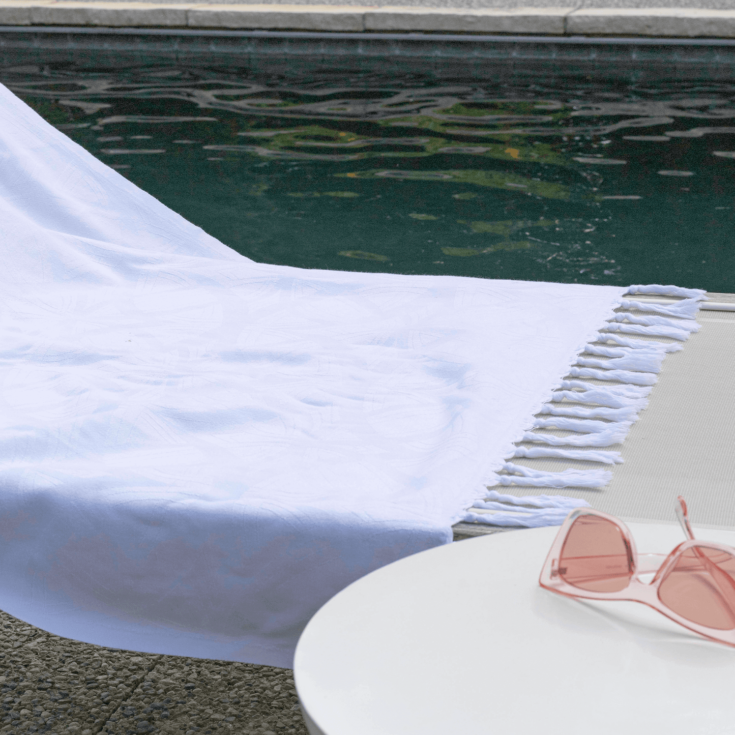 White Turkish towel poolside