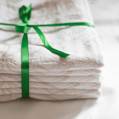 oat and white Turkish hand towel wrapped as a gift