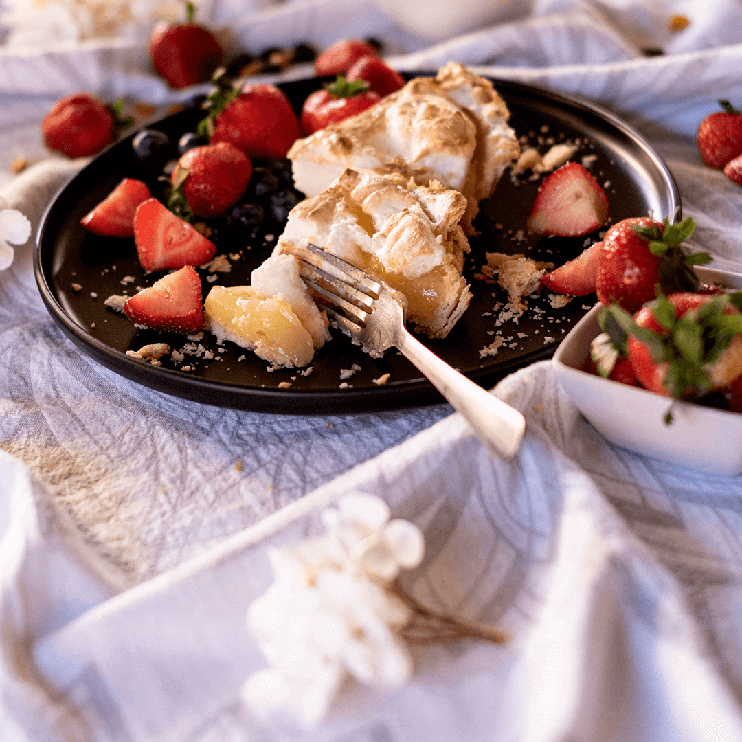 Turkish towel used as a tablecloth with pie and strawberries