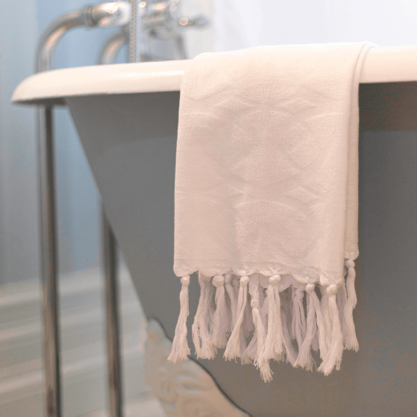 Turkish towels Canada in all white. Luxury Turkish cotton with a surface pattern designed in Canada. Sustainable and machine washable.