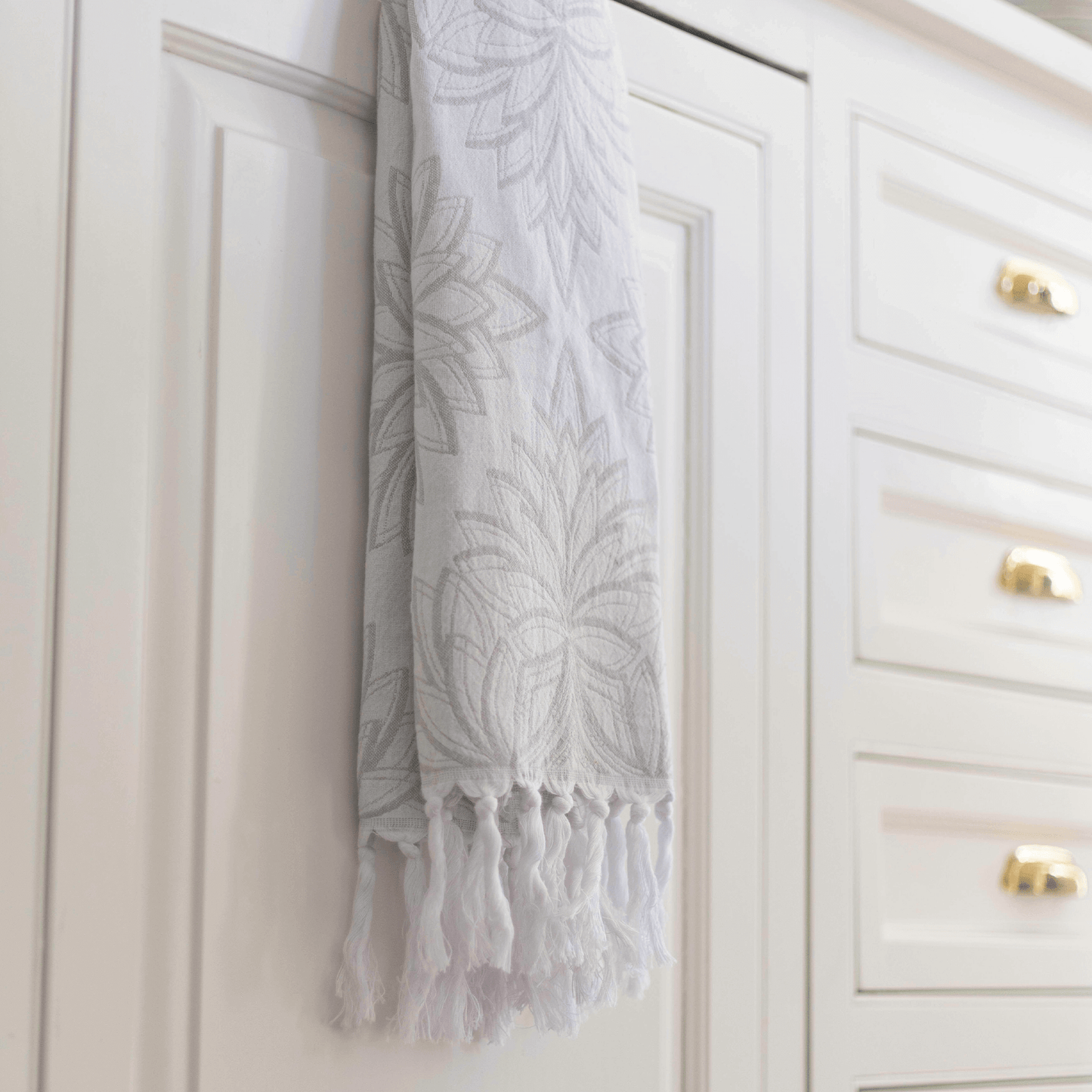 Grey and white Turkish towel in the kitchen as tea towel