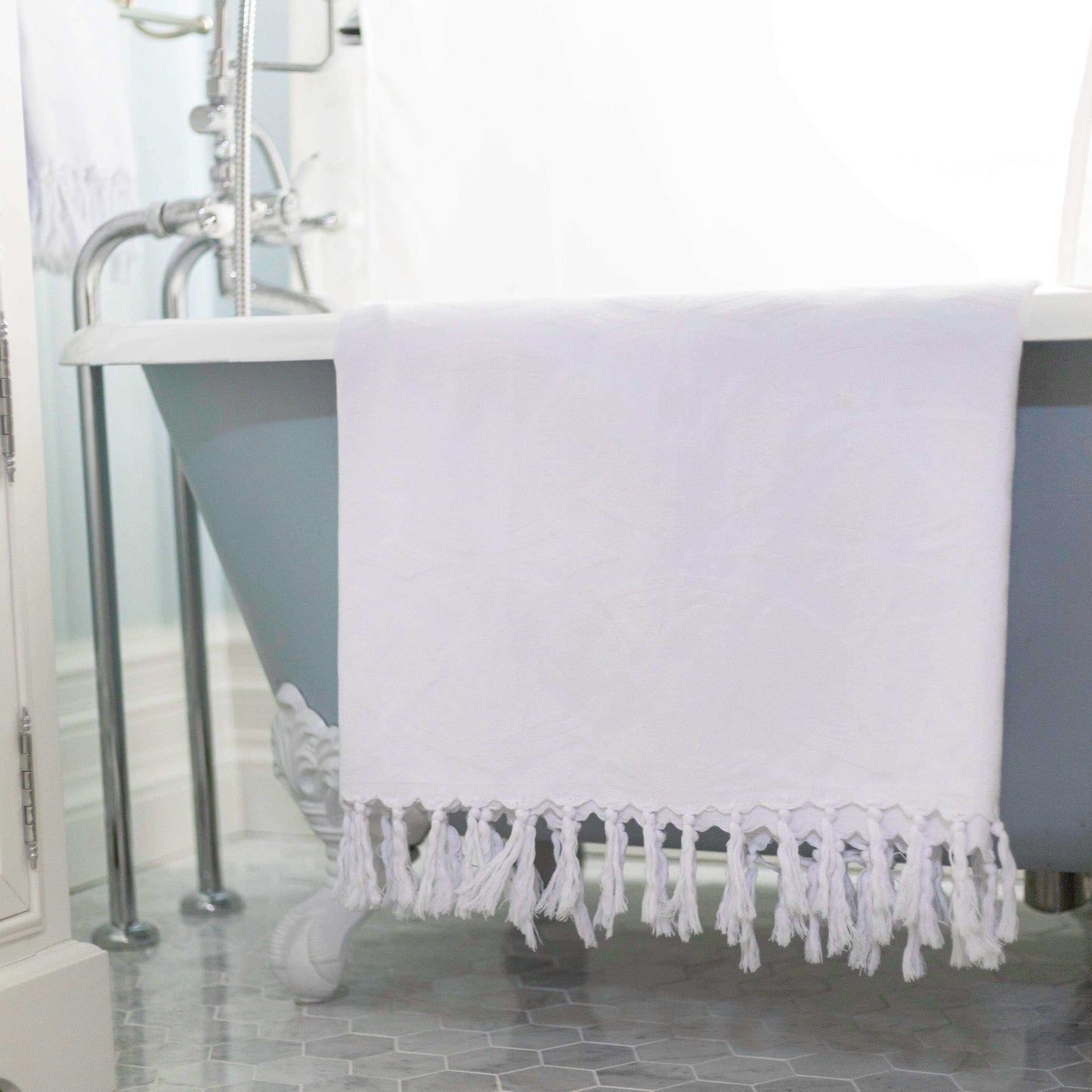 Turkish towels Canada in pure cotton for sustainability. All white with surface pattern design.
