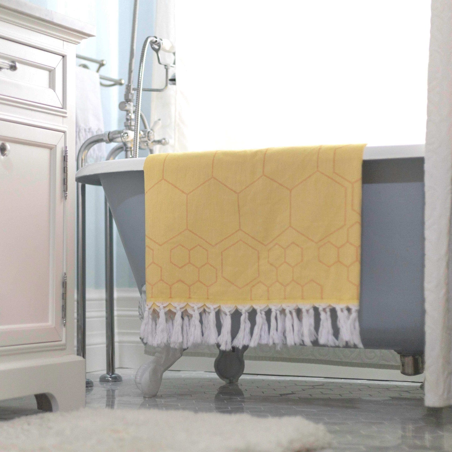 Turkish towels Canada in pure cotton for sustainability. Yellow and orange honeycomb design.