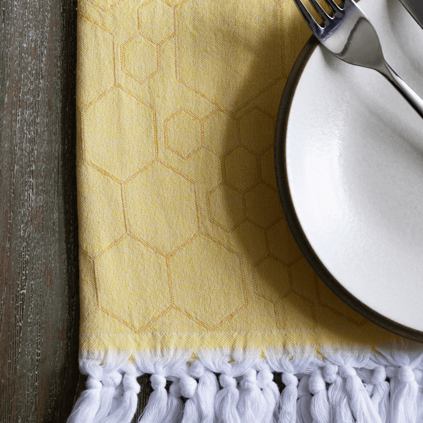 Yellow Turkish hand towel as a hand towel for dinner