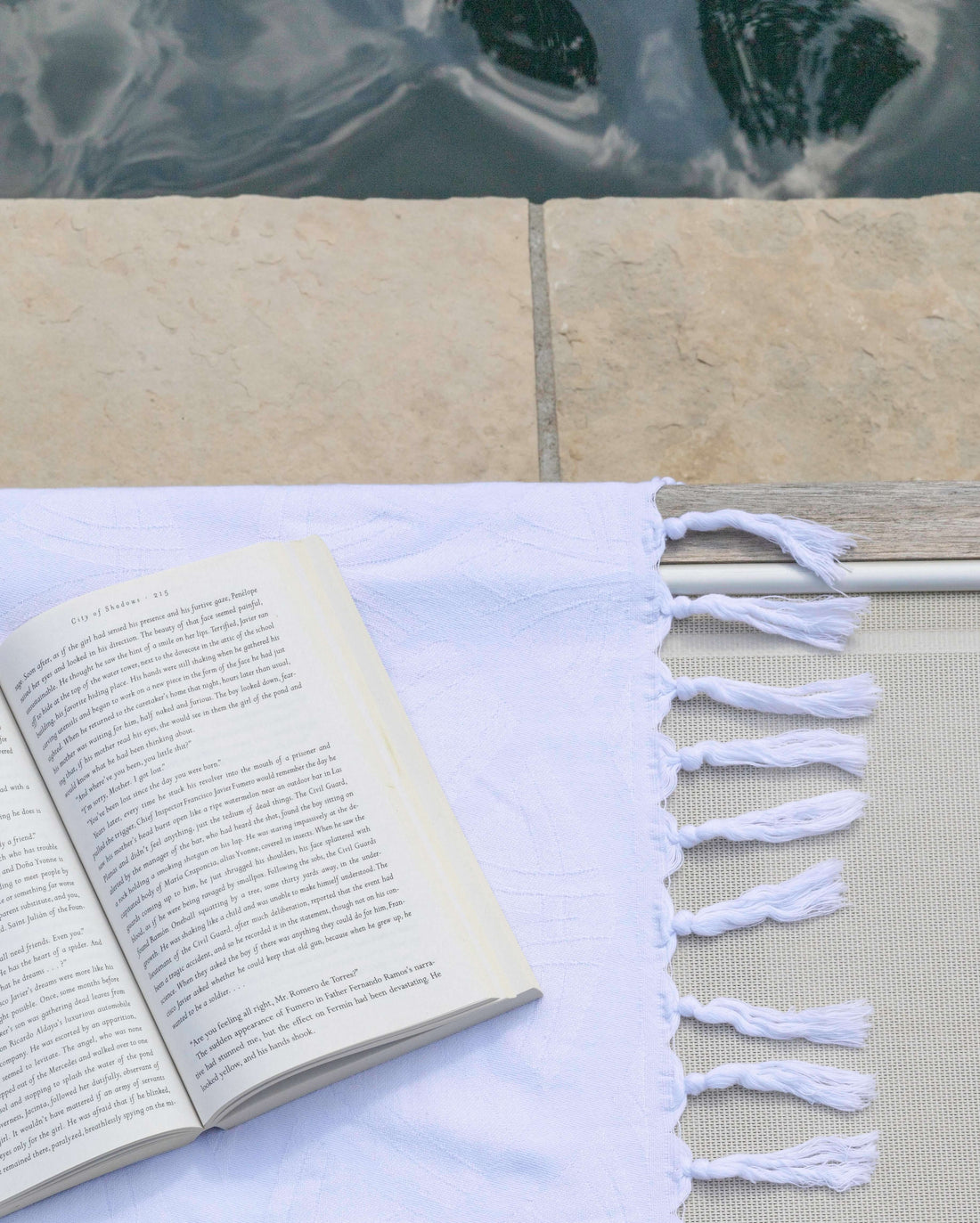 White Turkish towel poolside