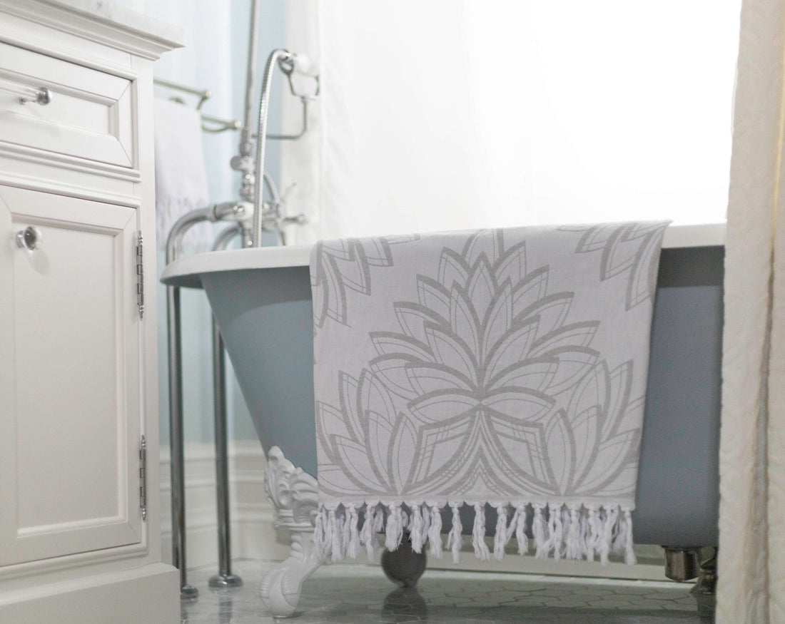 Luxury Turkish towel hanging from a clawfoot bathtub. Cottage core Canada