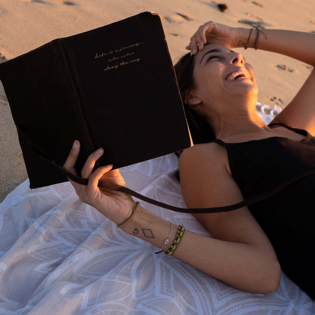 Woman smiles on her Turkish towel