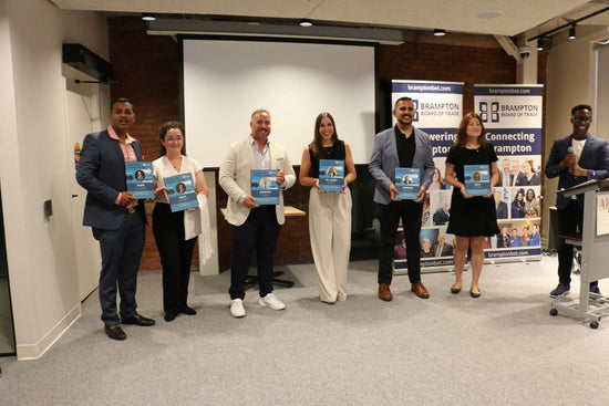 The 2022 June cohort of Intrepid leader award recipients stand together as they receive their award. Included is Nikky Starrett founder of Pomp & Sass second from the left