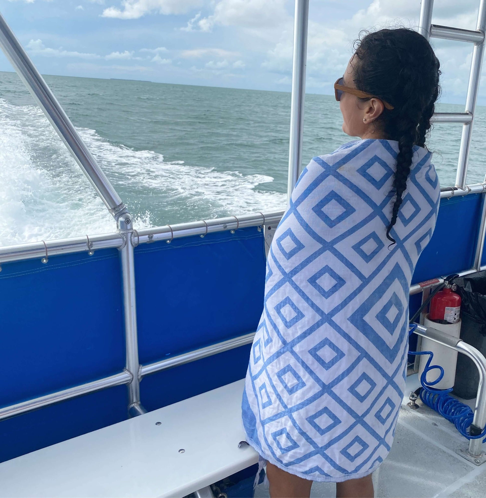 Woman on a boat wrapped with a Turkish towel