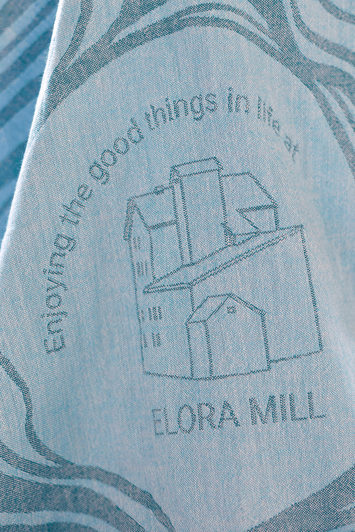 Elora Mill Spa logo woven into a Turkish towel by Pomp & Sass