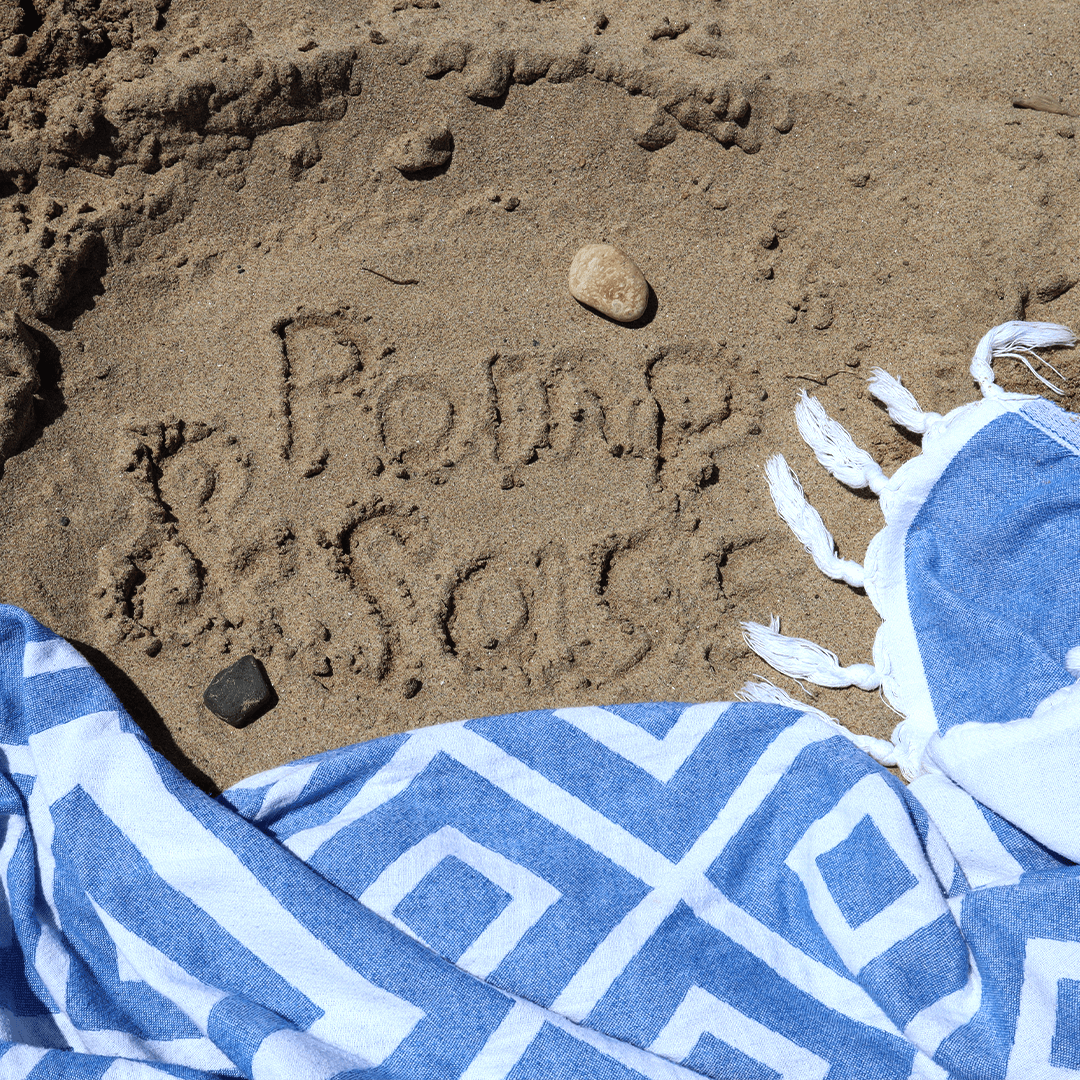 Turkish towel on the beach. Sand doesn't stick. 