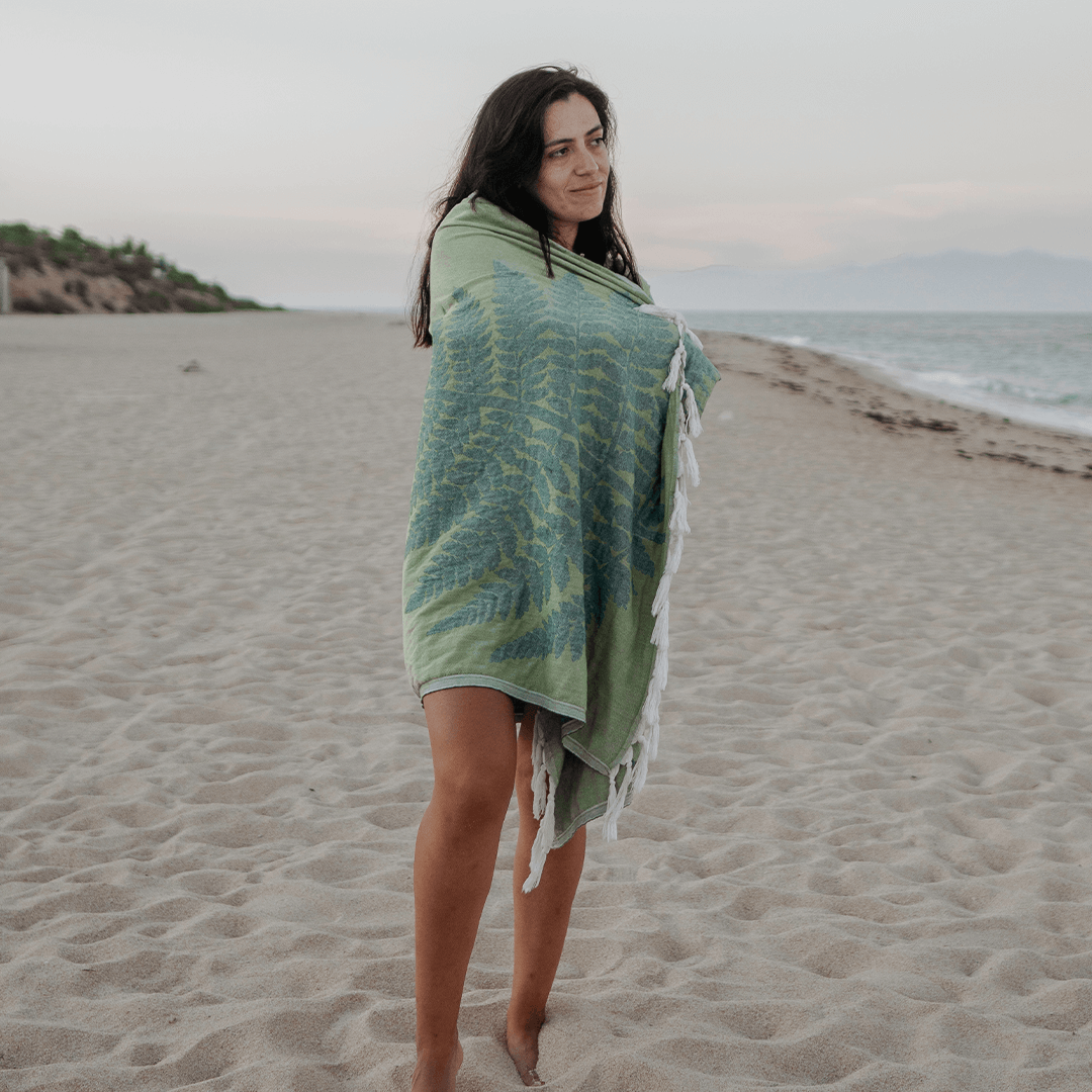 Woman wrapped in a Turkish towel at the beach