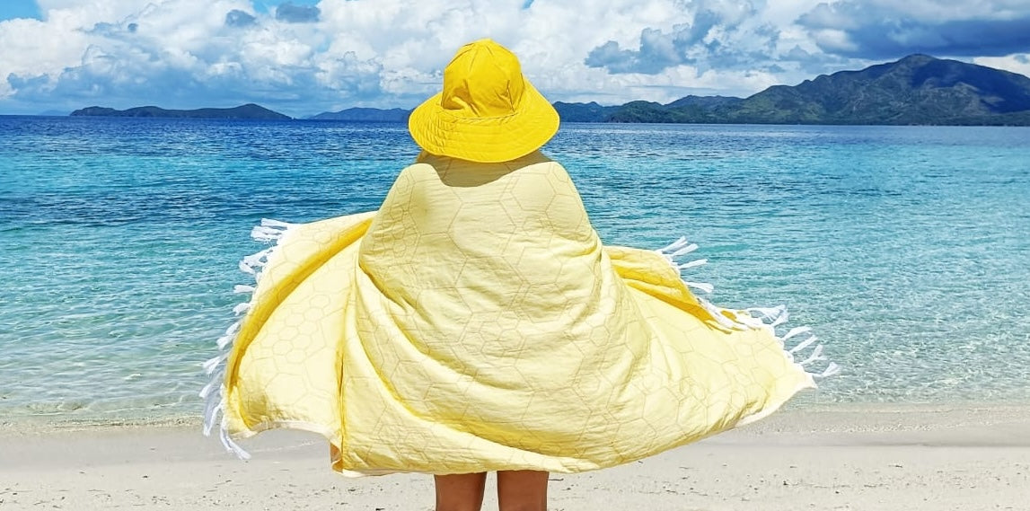 https://pompandsass.ca/cdn/shop/files/Yellow_Turkish_towel_beach_sunny.jpg?v=1701199114&width=3840