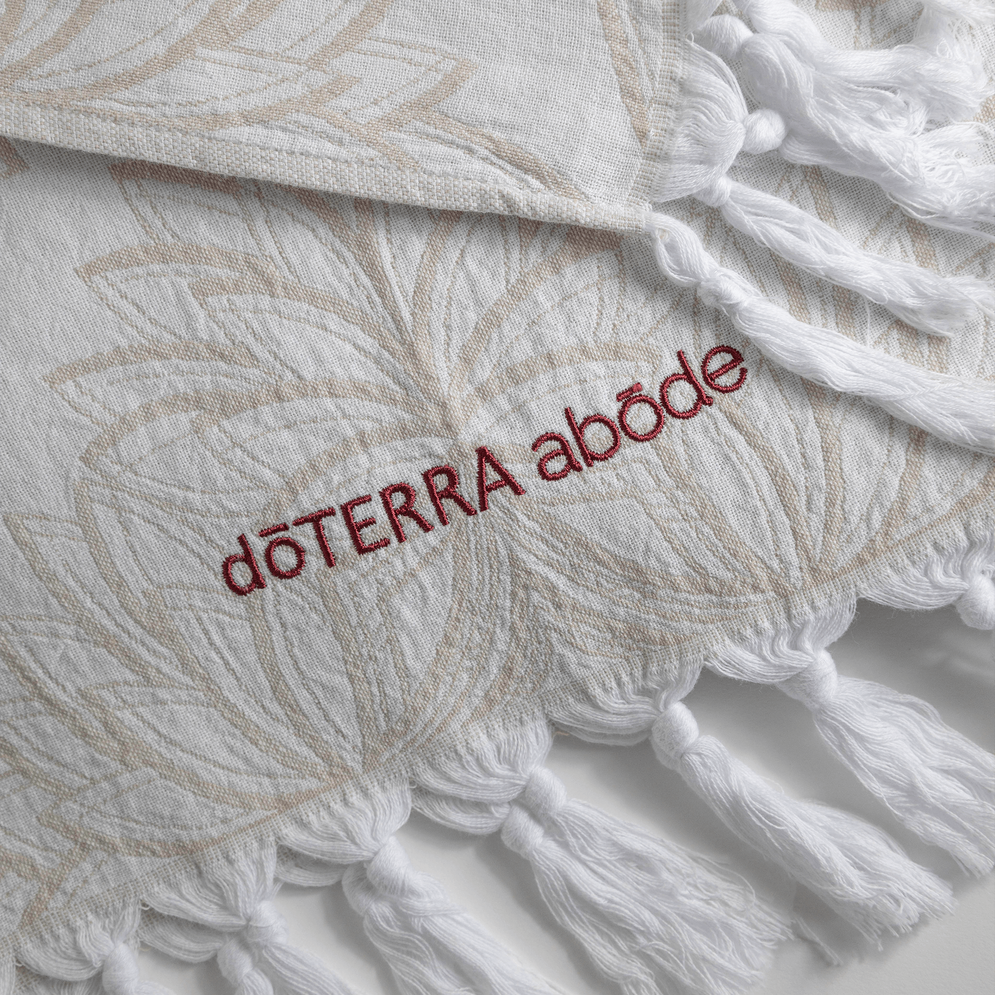 Custom doTerra hand towels with the doTERRA abode logo embroidered onto the hand towels. Custom Turkish cotton hand towels for marketing merchandise towards a recognition program
