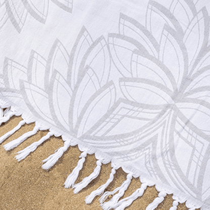 Grey and white Turkish cotton towel on the beach