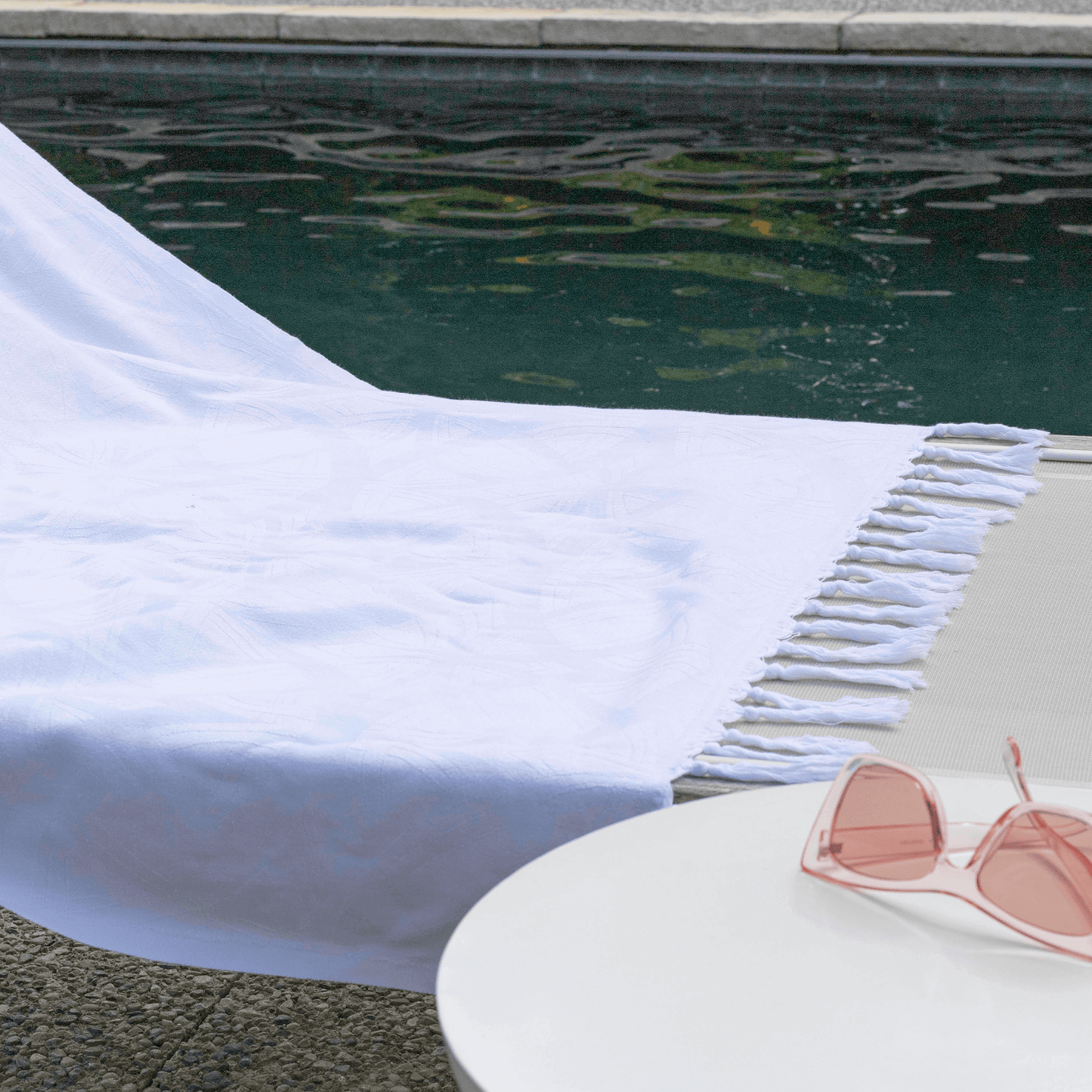 White Turkish towel poolside 