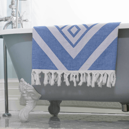 White and blue Turkish towel in the bath