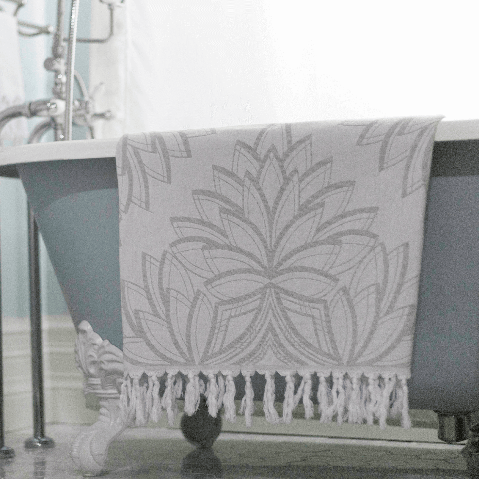 Grey and white Turkish towel in the bath