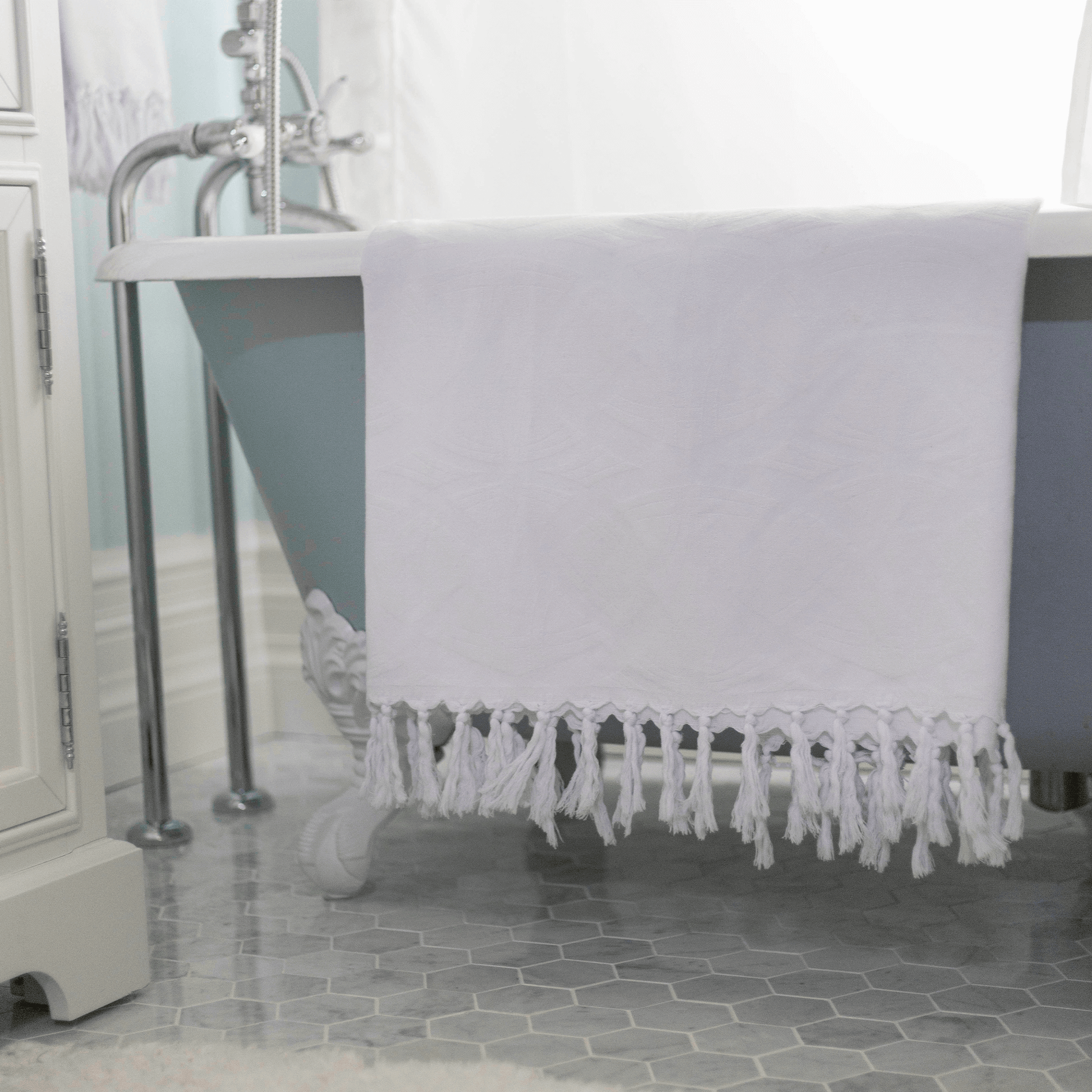 A white Turkish towel in the bath