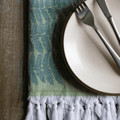 Green Turkish towel as hand towel at dinner