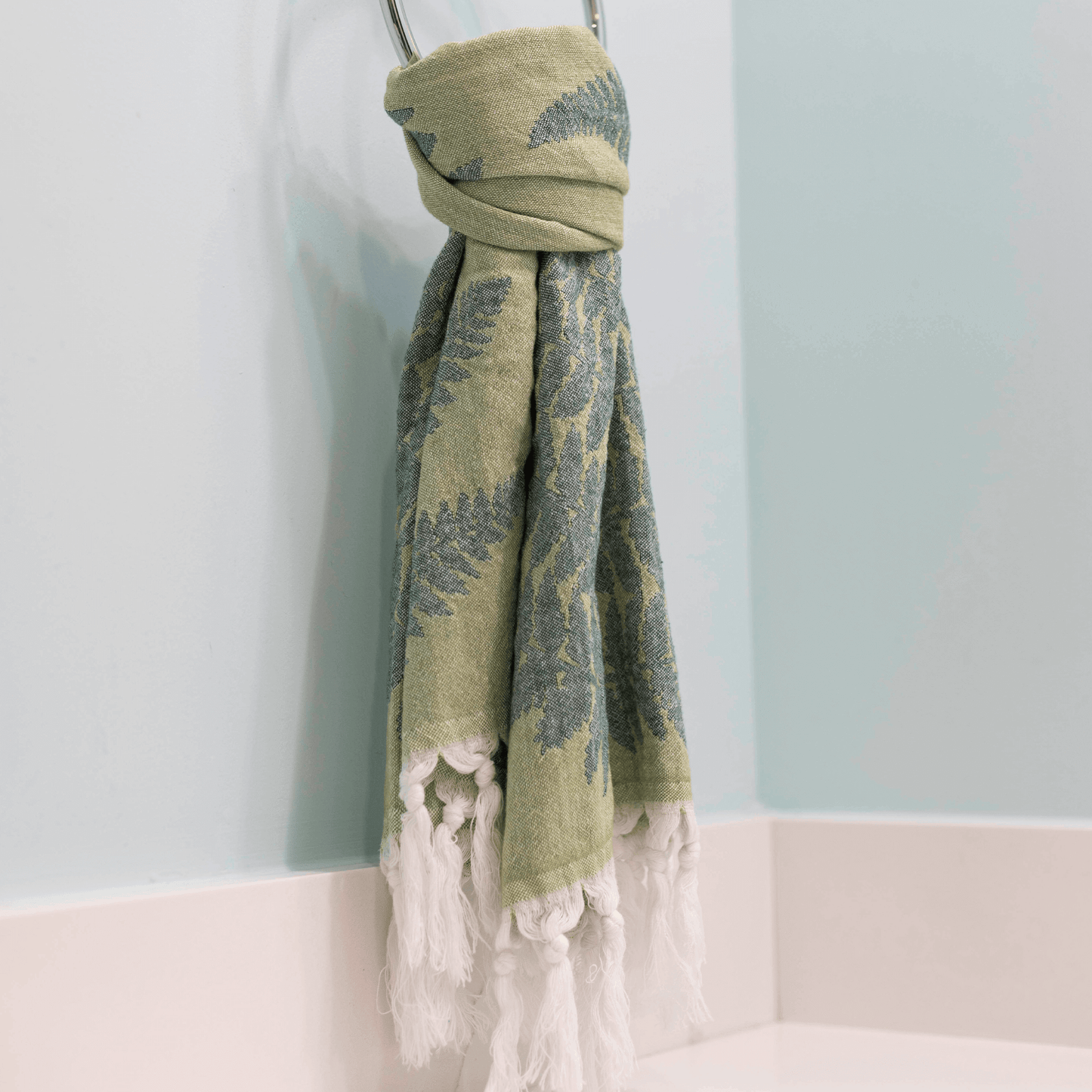 Green Turkish towel as hand towel in bath