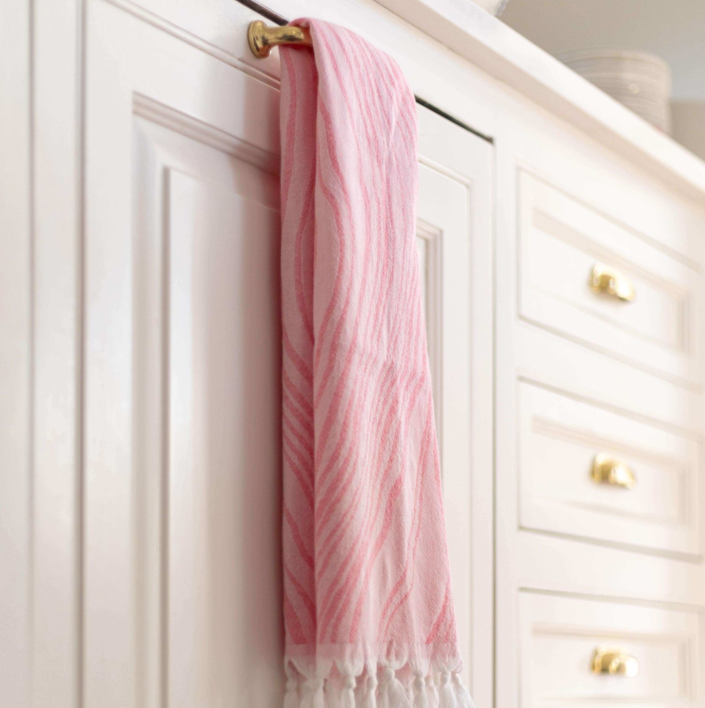 Pink Turkish hand towel hanging in the kitchen as a tea towel