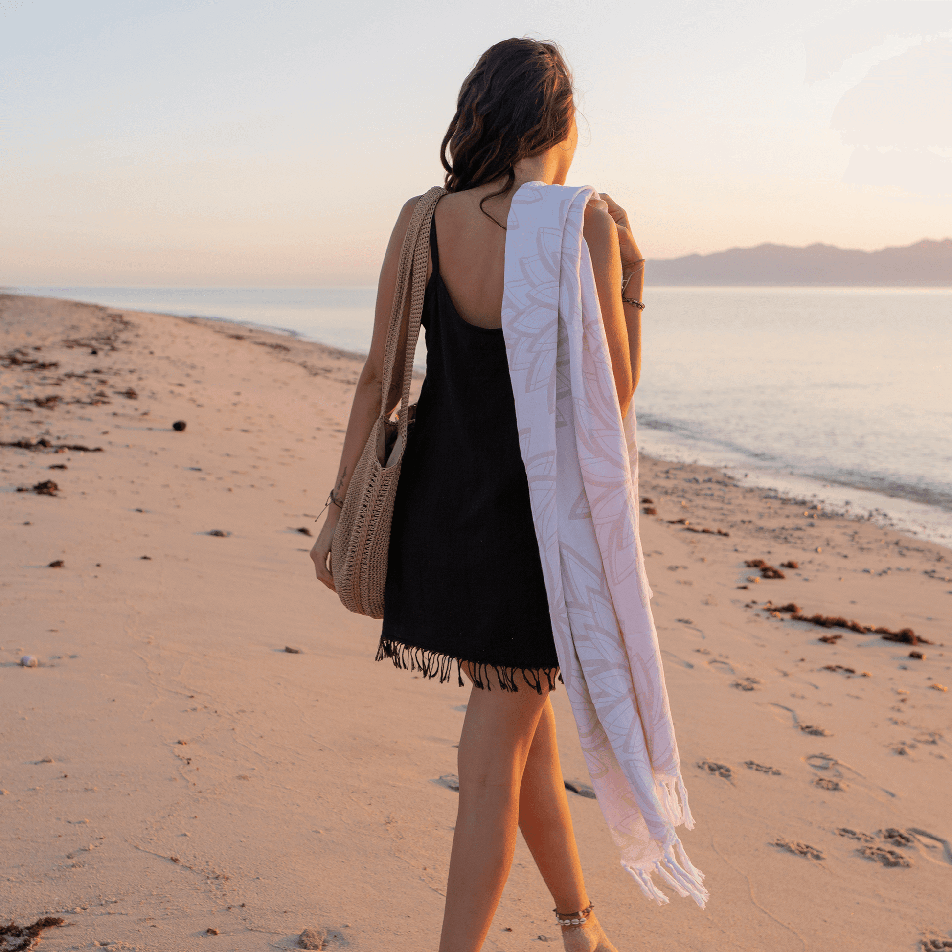 Woman at the beach with a Turkish towel