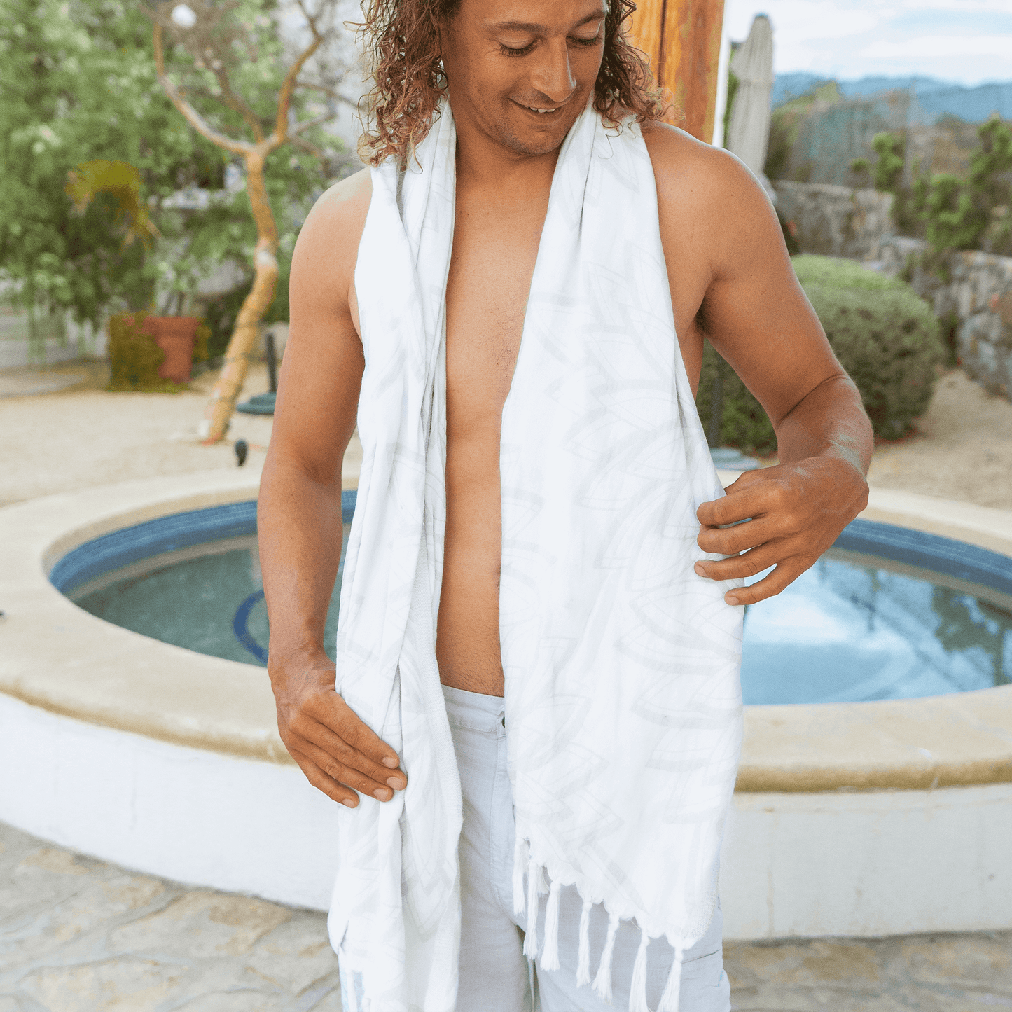 Man at a resort using a Turkish towel