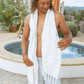 Shirtless man at a luxury resort using a Turkish towel