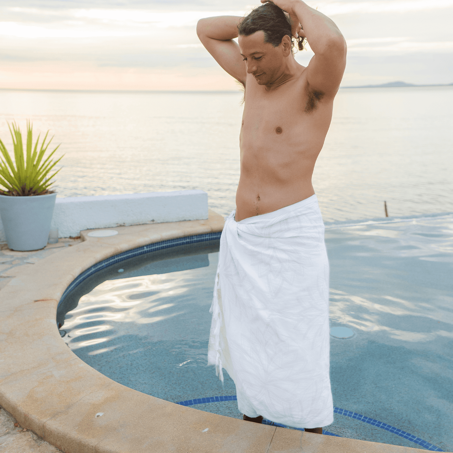 Man at a luxury resort using a Turkish towel