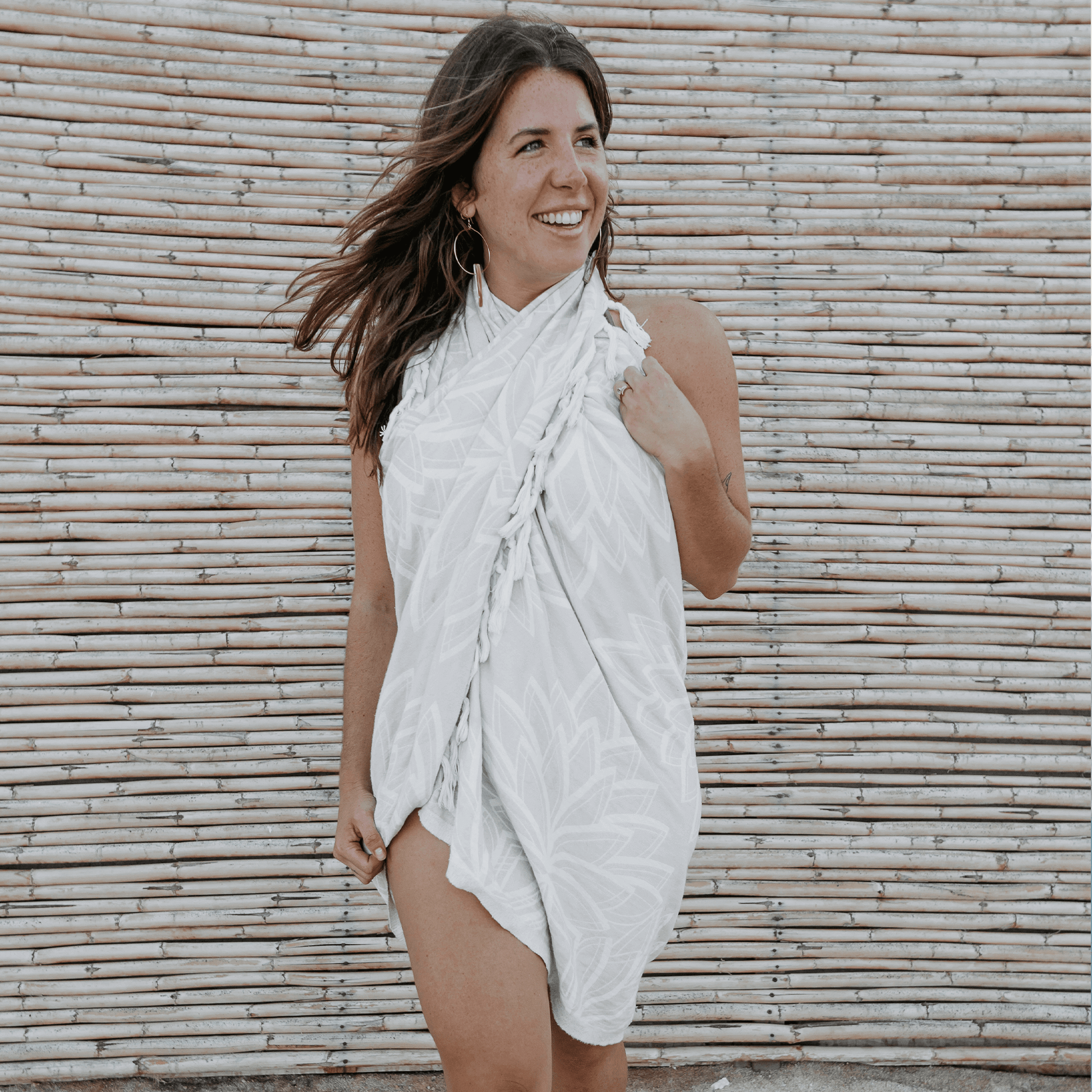 woman on the beach with a Turkish towel