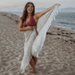 woman on the beach with a Turkish towel