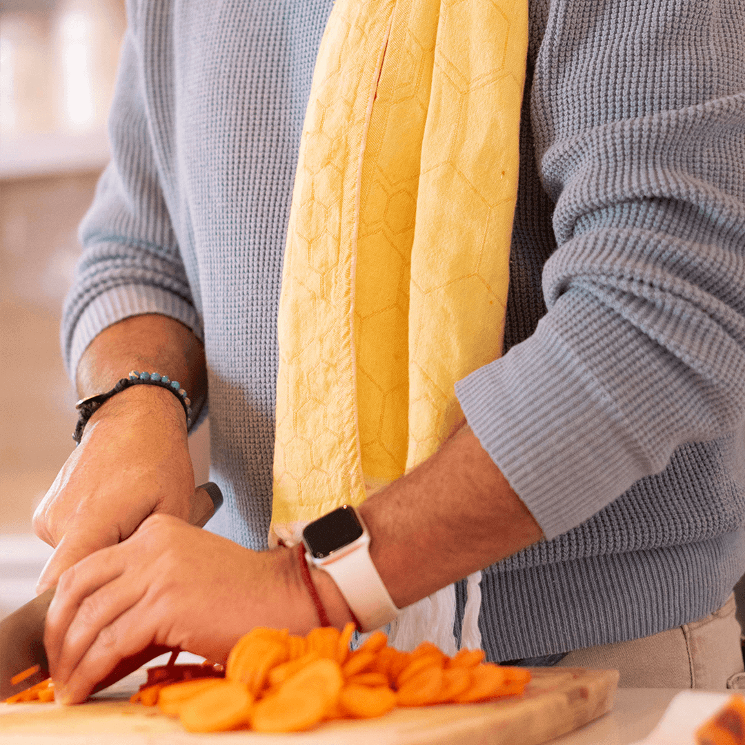 Man in the kitchen using a Yellow Turkish Hand Towel as a tea towel
