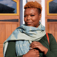 smiling woman wearing Green fern set of Turkish towels as a scarf