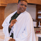 smiling woman in a white Turkish towel as a shawl