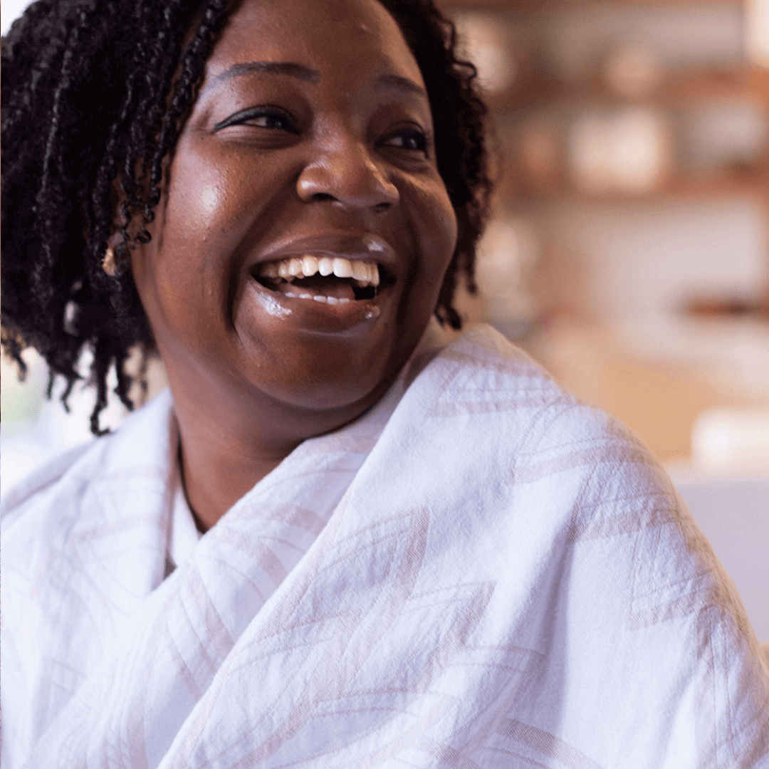 Laughing woman with a Turkish towel