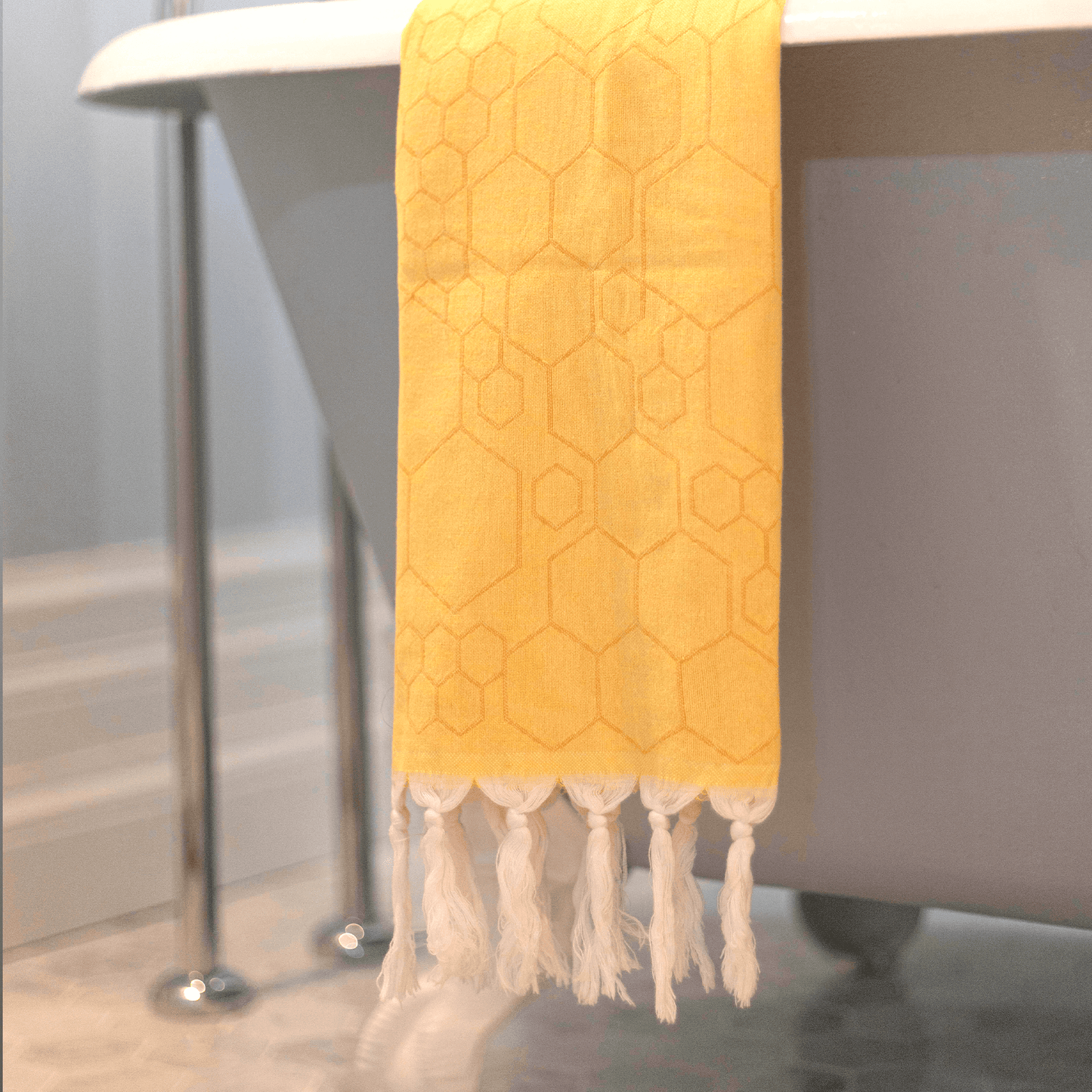  Yellow Turkish hand towel hanging in the bath