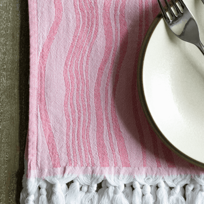 Pink Turkish hand towel with dinner plate