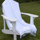 White Turkish towel covering an Adirondack chair