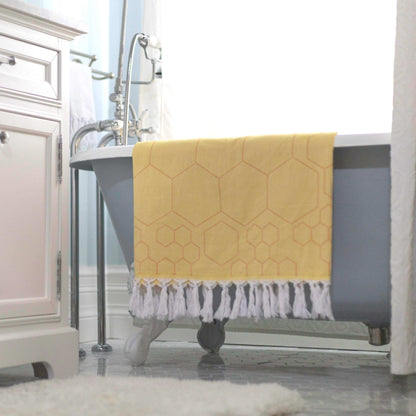 Yellow orange honeycomb pattern Turkish towel in the bath