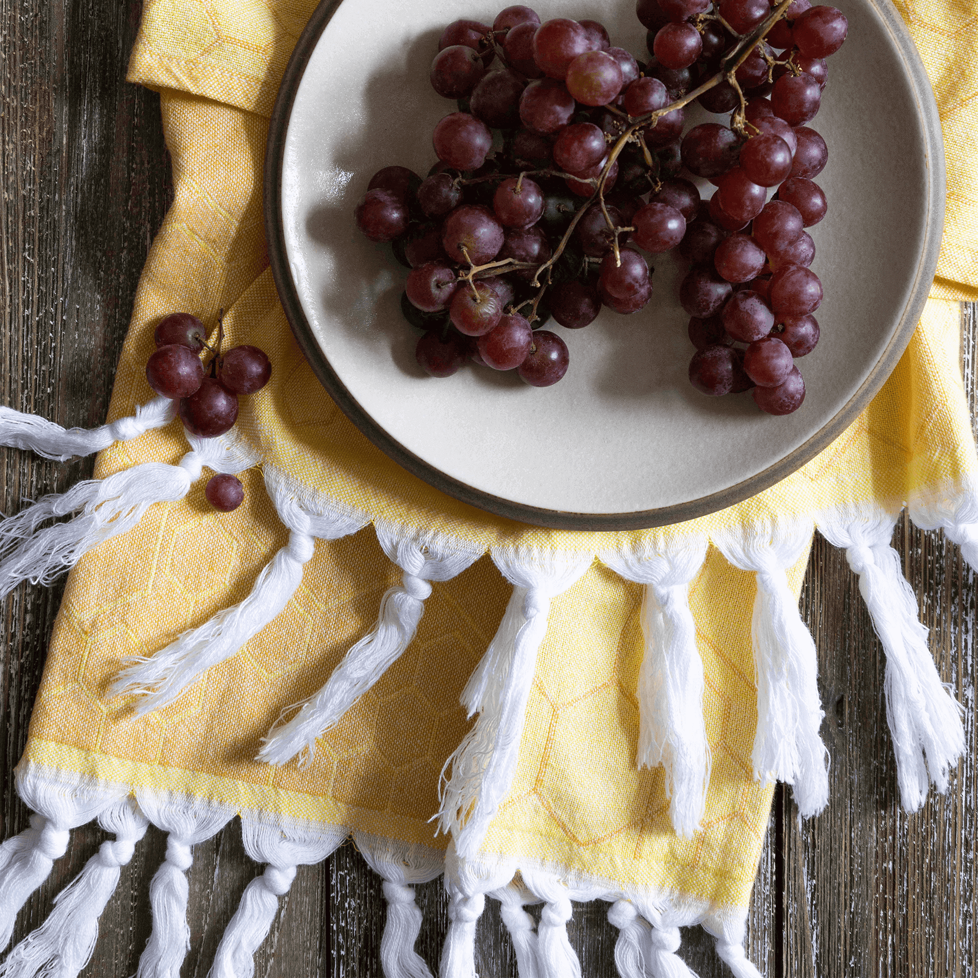 Yellow and orange Turkish towel with grapes